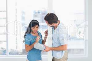 Man offering gift to his girlfriend