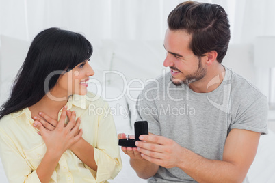 Man proposing to his surprised girlfriend