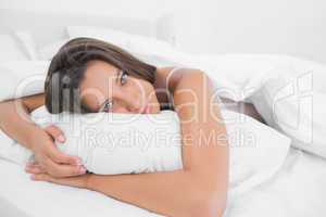 Awake woman relaxing in bed