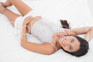 Attractive woman lying in bed