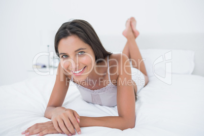 Woman relaxing lying in bed