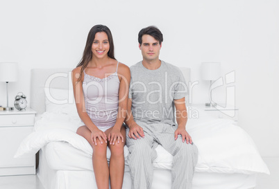 Portrait of a couple sitting in bed