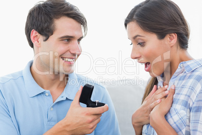 Man offering an engagement ring to his girlfriend