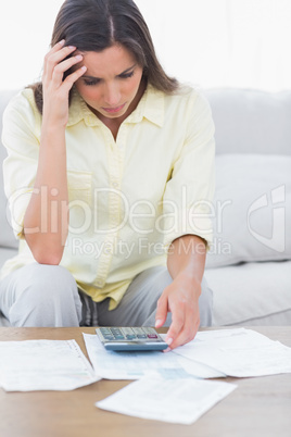 Stressed woman doing her accounts