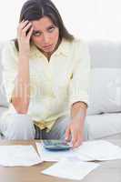 Anxious woman doing her accounts