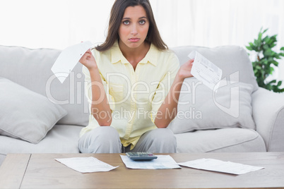 Concerned woman doing her accounts