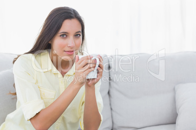 Portrait of a woman holding a cup of coffee