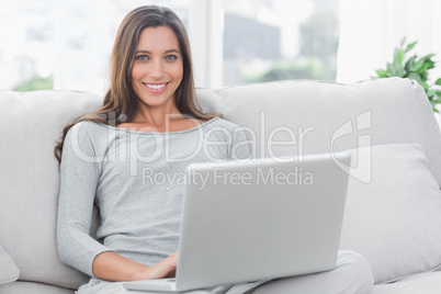 Portrait of a woman using her laptop