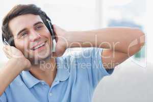 Cheerful man enjoying music