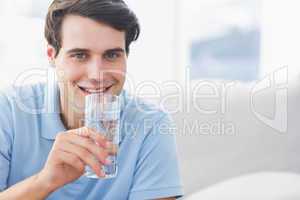 Man holding a glass of water