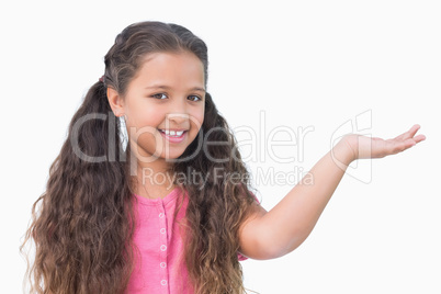 Little girl presenting something