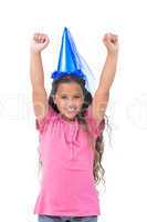Little girl with blue hat holding up her arms