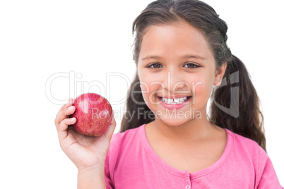 Little girl holding apple in her hand