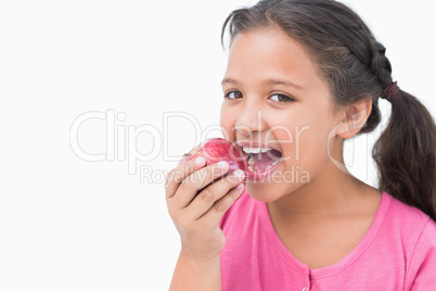 Little girl eating apple