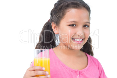 Little girl drinking orange juice