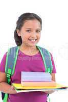 Smiling little girl wearing book bag and holding her homework