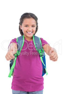 Little girl with book bag does thumbs up at camera