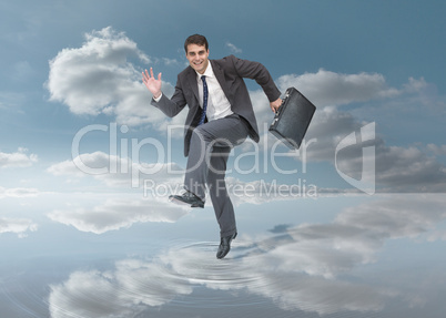 Businessman walking on a puddle