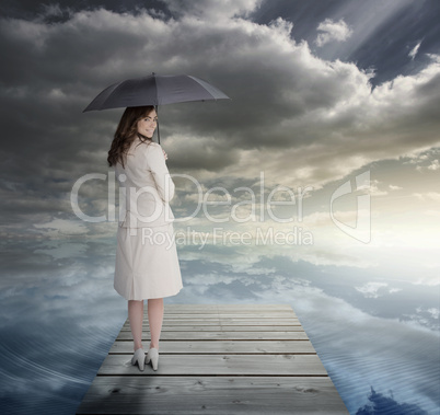 Businesswoman standing on bridge