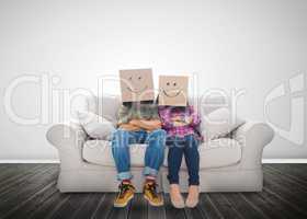 Funny couple wearing boxes on their head