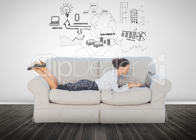Cheerful businesswoman lying on couch