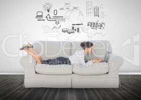 Cheerful businesswoman lying on couch