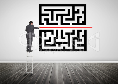 Businessman standing on a ladder drawing red line through qr cod