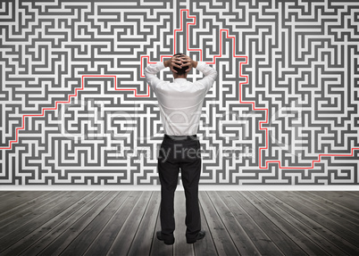 Confused businessman looking at a maze