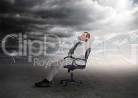 Attractive businessman sitting on a swivel chair