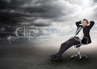 Businessman sitting in a swivel chair