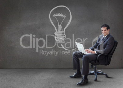 Businessman using his laptop with arrow graphic coming from it