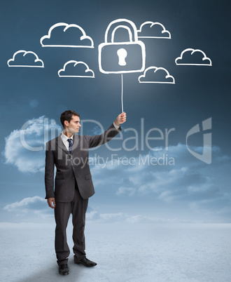 Businessman holding a floating padlock around clouds