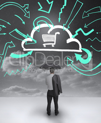 Businessman looking at a drawing of a cloud with shopping cart