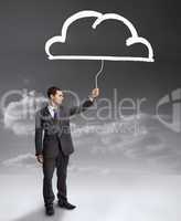 Businessman holding a drawing of a cloud