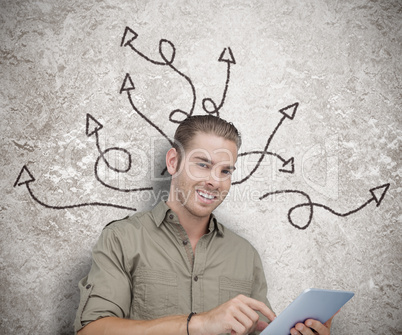 Cheerful man using a tablet