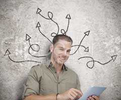 Cheerful man using a tablet