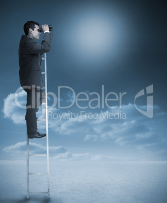 Businessman standing on ladder over clouds