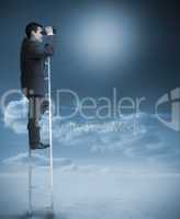 Businessman standing on ladder over clouds