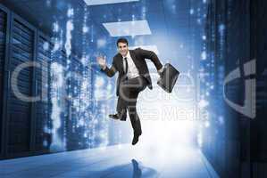 Businessman jumping in a corridor
