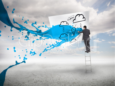 Businessman standing on a ladder with blue paint splash