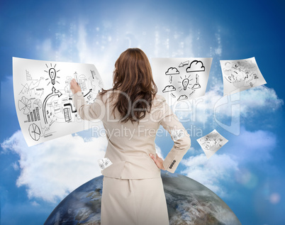 Businesswoman drawing on a floating sheet