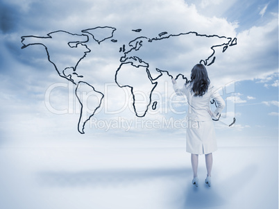 Businesswoman drawing a world map