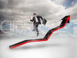 Businessman jumping over a red arrow pointing up