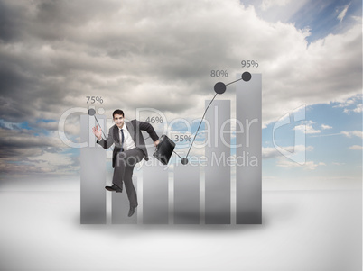 Businessman jumping next to a chart