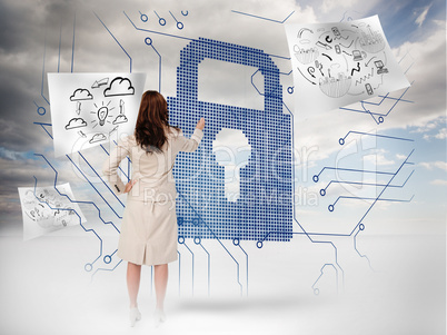 Businesswoman selecting a giant padlock