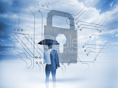 Businessman under an umbrella looking at a big padlock