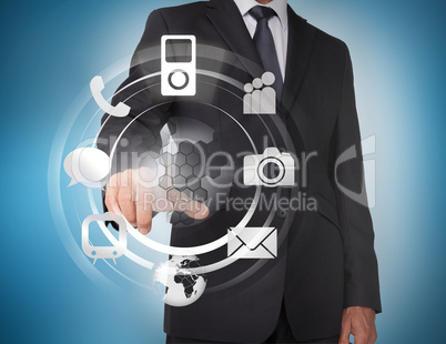 Businessman selecting icons on a hologram