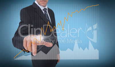 Businessman touching a curve of a chart
