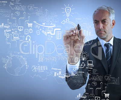 Businessman holding a marker and drawing