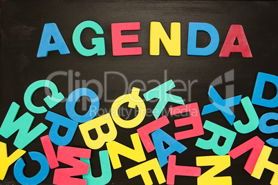 The word agenda written with colored letters